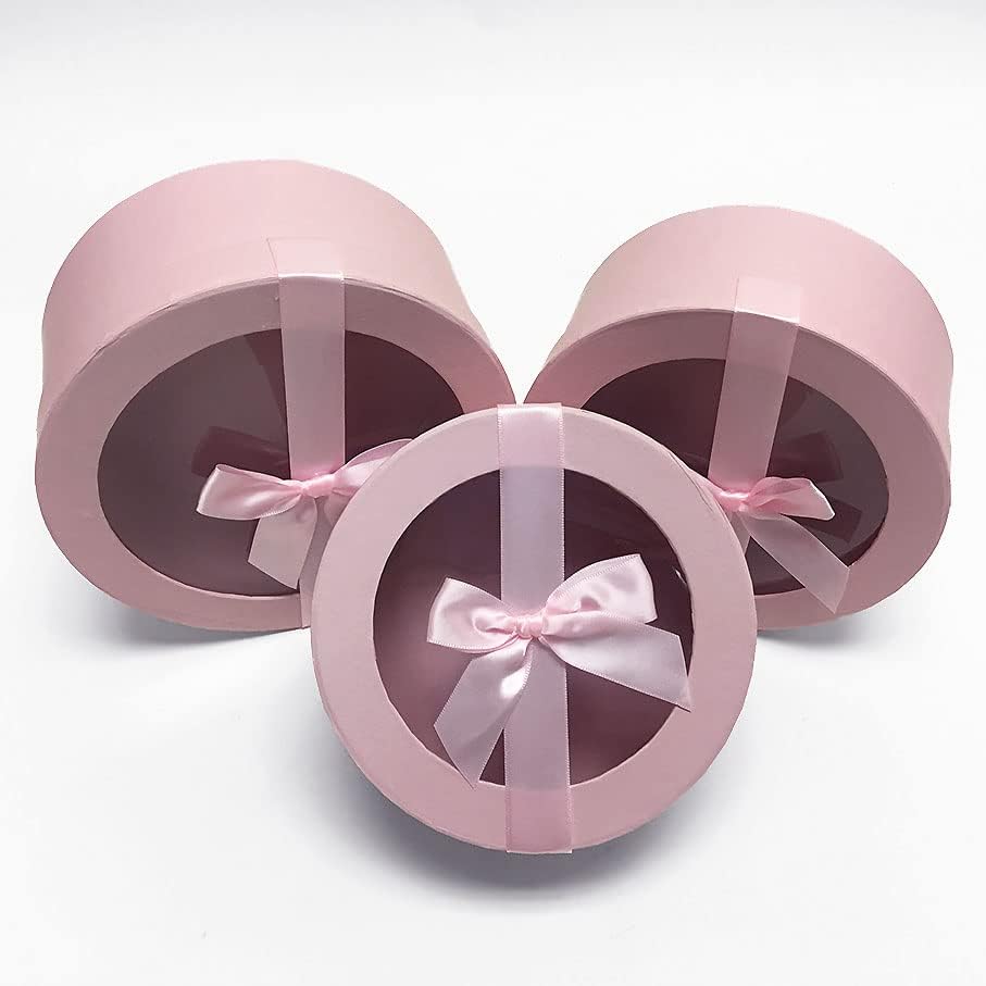 Okrugla cilindrična ambalažna poklon kutija s prozirnim poklopcem i trakom od svilene ružičaste vrpce